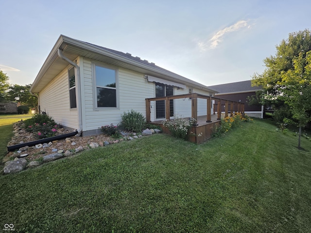 21 Watson Dr, Trafalgar, IN 46181 - rear view of house with a yard and a deck