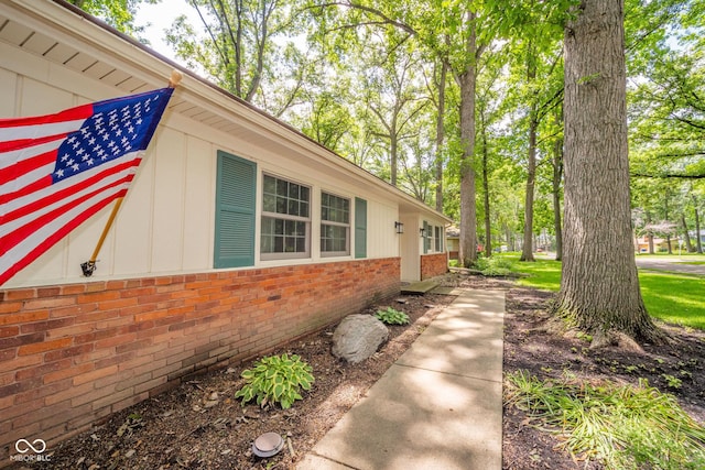 2613 W Queensbury Rd, Muncie, IN 47304 - view of side of property with brick siding and board and batten siding