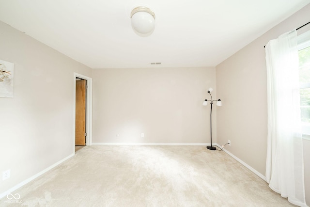 2613 W Queensbury Rd, Muncie, IN 47304 - spare room featuring light colored carpet and baseboards