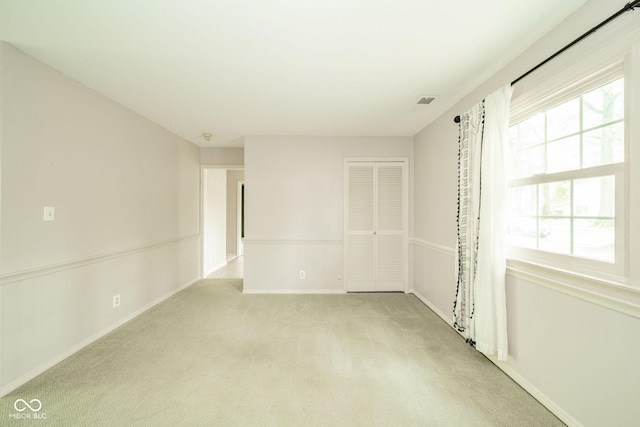 2613 W Queensbury Rd, Muncie, IN 47304 - unfurnished room with light carpet and baseboards