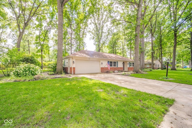 2613 W Queensbury Rd, Muncie, IN 47304 - ranch-style home featuring brick siding, a garage, driveway, and a front yard