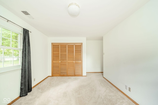 2613 W Queensbury Rd, Muncie, IN 47304 - unfurnished bedroom with a closet and carpet