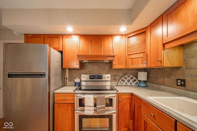 2613 W Queensbury Rd, Muncie, IN 47304 - kitchen featuring appliances with stainless steel finishes, light countertops, tasteful backsplash, custom range hood, and recessed lighting