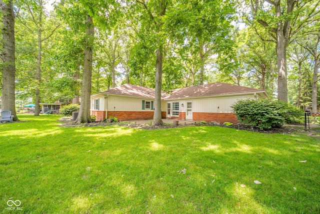 2613 W Queensbury Rd, Muncie, IN 47304 - rear view of property featuring brick siding