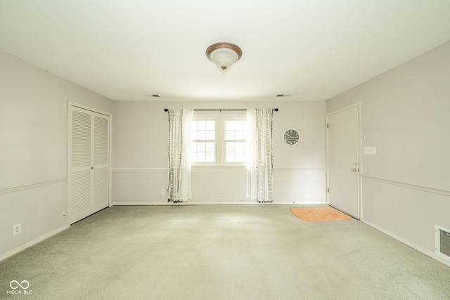2613 W Queensbury Rd, Muncie, IN 47304 - carpeted empty room with baseboards