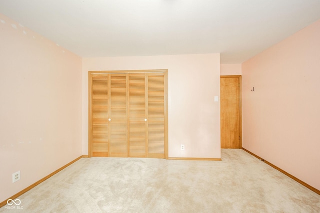 2613 W Queensbury Rd, Muncie, IN 47304 - unfurnished bedroom featuring a closet and carpet flooring