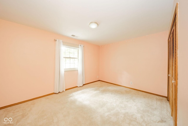 2613 W Queensbury Rd, Muncie, IN 47304 - unfurnished bedroom with light colored carpet and a closet