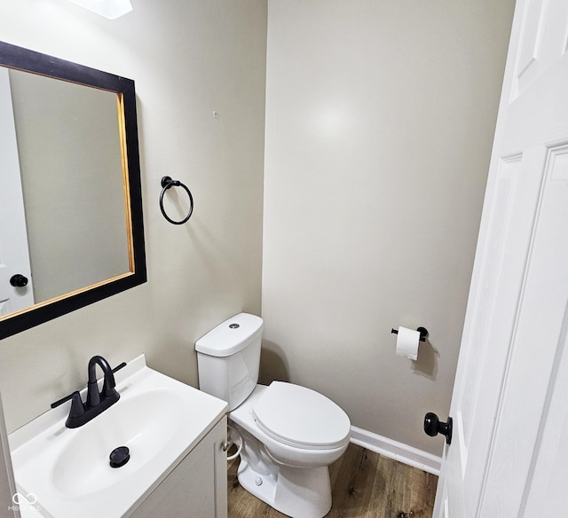 2527 E 10th St, Indianapolis, IN 46201 - bathroom featuring wood finished floors and vanity