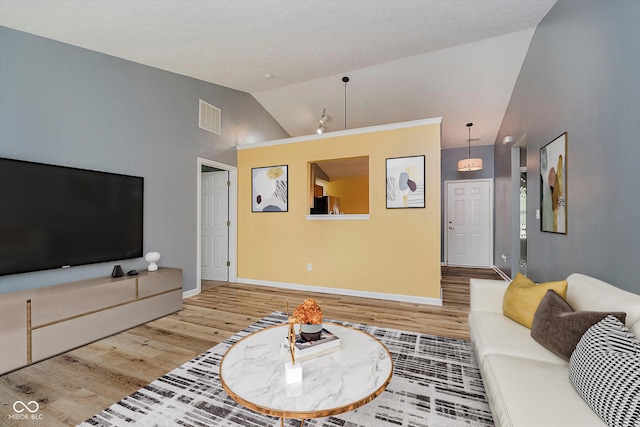 16629 Greensboro Dr, Westfield, IN 46074 - living room featuring vaulted ceiling and wood finished floors