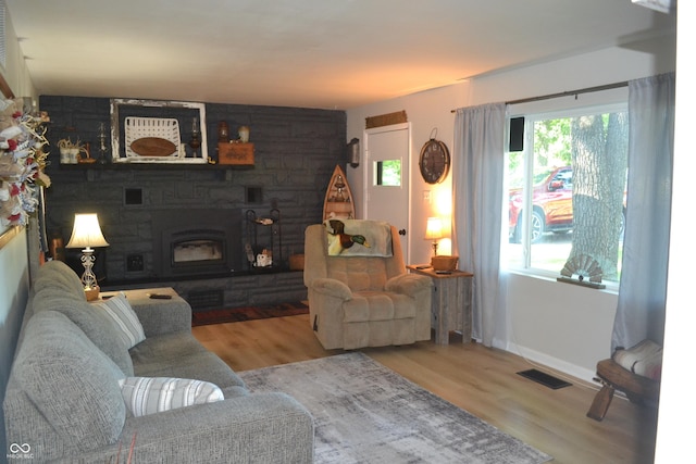 704 S Rockfield Rd, Veedersburg, IN 47987 - living room with wood finished floors and a stone fireplace