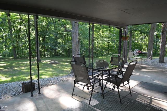 704 S Rockfield Rd, Veedersburg, IN 47987 - view of patio / terrace with outdoor dining area and a forest view
