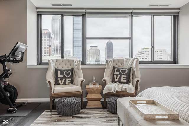225 N New Jersey St Unit 52, Indianapolis, IN 46204 - living area with wood finished floors, plenty of natural light, and a city view