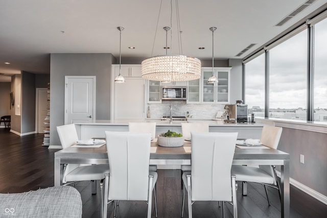 225 N New Jersey St Unit 52, Indianapolis, IN 46204 - dining area featuring dark wood-style flooring, recessed lighting, and a chandelier