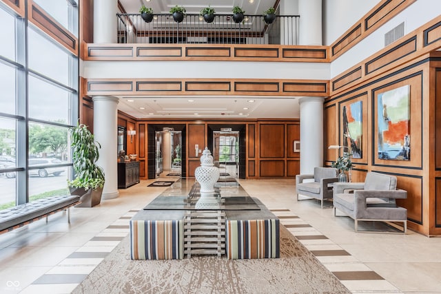 225 N New Jersey St Unit 52, Indianapolis, IN 46204 - community lobby with a towering ceiling, a decorative wall, and recessed lighting