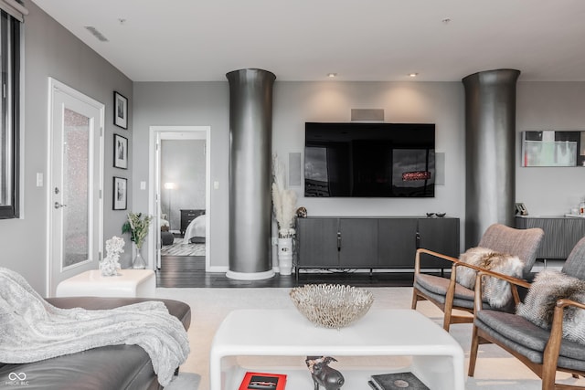 225 N New Jersey St Unit 52, Indianapolis, IN 46204 - living area with wood finished floors and ornate columns