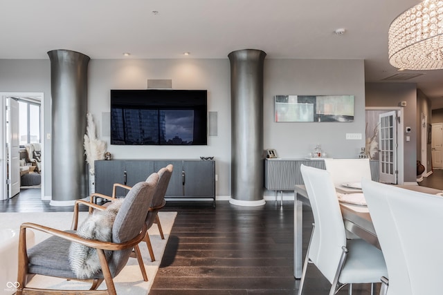 225 N New Jersey St Unit 52, Indianapolis, IN 46204 - dining space featuring dark wood finished floors, decorative columns, and recessed lighting