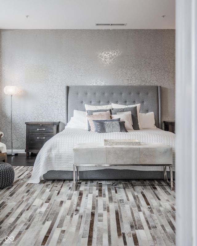 225 N New Jersey St Unit 52, Indianapolis, IN 46204 - bedroom featuring wood finished floors and wallpapered walls