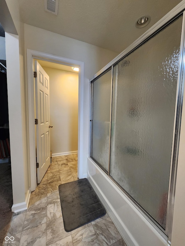 7511 Eddie Ln, Camby, IN 46113 - full bathroom featuring marble finish flooring and combined bath / shower with glass door