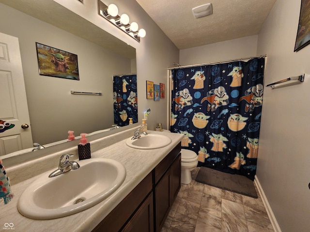 7511 Eddie Ln, Camby, IN 46113 - bathroom featuring a textured ceiling, double vanity, and a shower with curtain