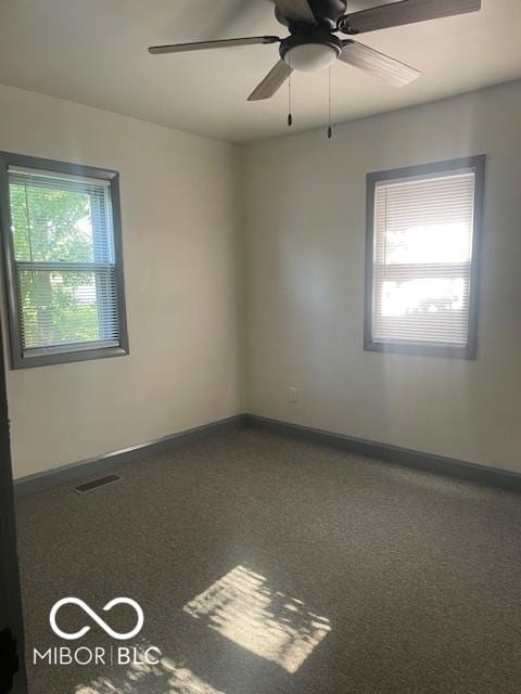 416 W 21st St, Anderson, IN 46016 - spare room featuring carpet floors and a ceiling fan