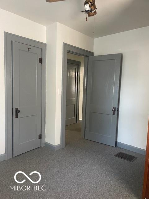 416 W 21st St, Anderson, IN 46016 - unfurnished bedroom featuring carpet floors and a ceiling fan