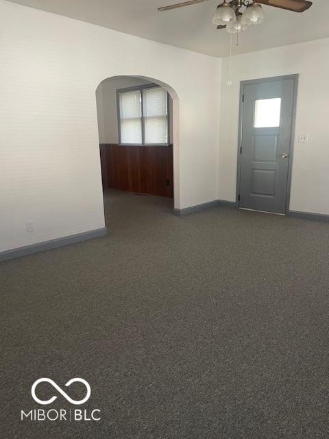 416 W 21st St, Anderson, IN 46016 - empty room featuring ceiling fan and arched walkways