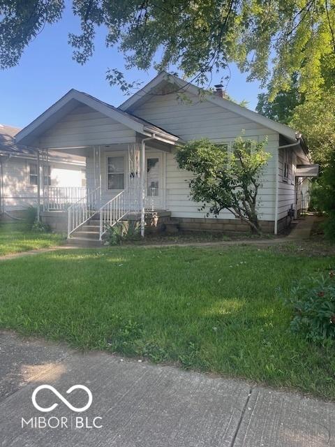 416 W 21st St, Anderson, IN 46016 - view of front of home featuring a front yard and covered porch