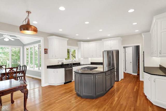 13779 Stone Dr, Carmel, IN 46032 - kitchen with appliances with stainless steel finishes, dark countertops, a ceiling fan, white cabinets, and recessed lighting