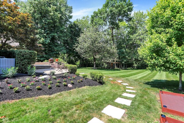 13779 Stone Dr, Carmel, IN 46032 - view of grassy yard with view of wooded area