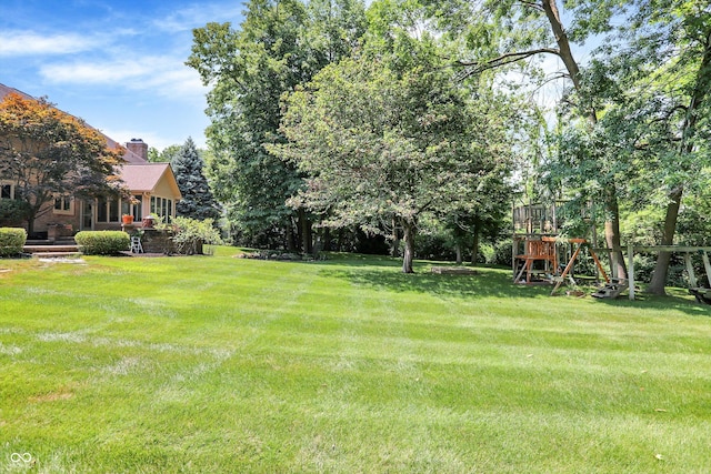 13779 Stone Dr, Carmel, IN 46032 - view of green lawn with a playground