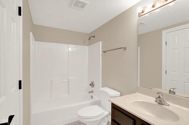 13779 Stone Dr, Carmel, IN 46032 - bathroom featuring vanity, shower / bath combination, a textured ceiling, and tile patterned flooring