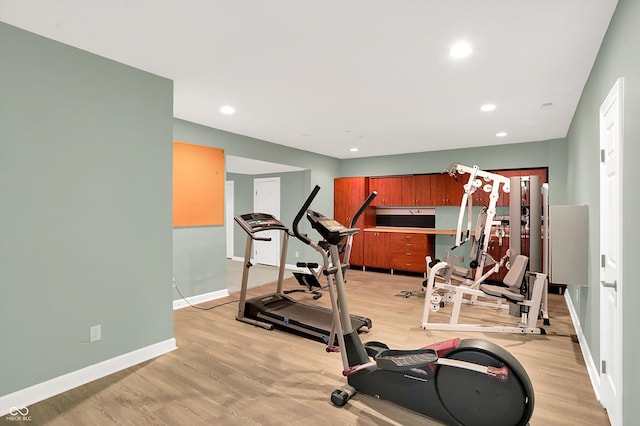 13779 Stone Dr, Carmel, IN 46032 - workout area with light wood-style floors and recessed lighting