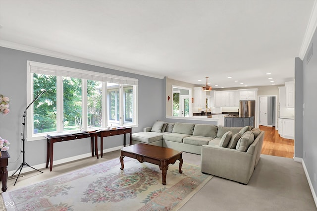 13779 Stone Dr, Carmel, IN 46032 - living area featuring crown molding, recessed lighting, and light wood-style floors
