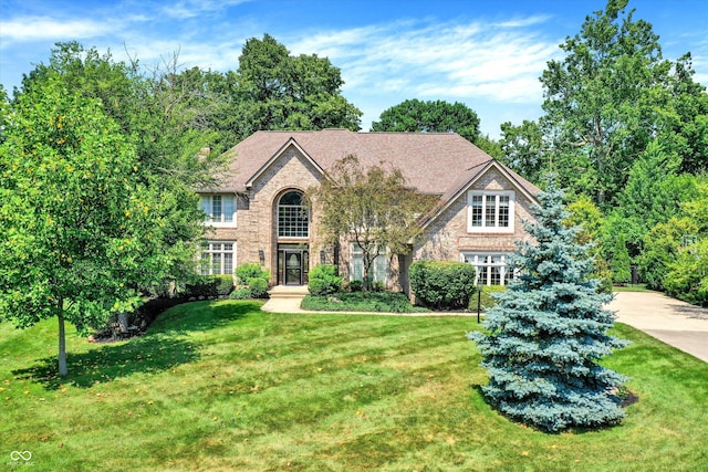 13779 Stone Dr, Carmel, IN 46032 - view of front facade with a front yard, brick siding, and stone siding