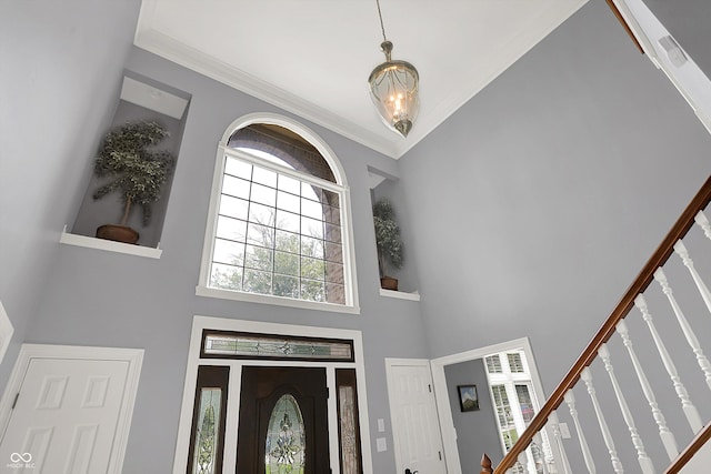 13779 Stone Dr, Carmel, IN 46032 - entrance foyer featuring stairway, a towering ceiling, and ornamental molding
