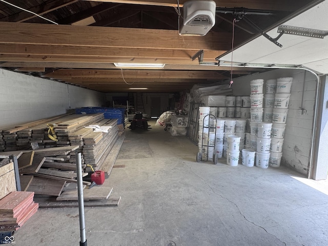 4503 W Minnesota St, Indianapolis, IN 46241 - garage featuring a garage door opener and concrete block wall