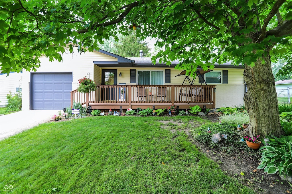 9042 Panorama Ct, Indianapolis, IN 46234 - view of front of house with a front lawn, brick siding, concrete driveway, and covered porch