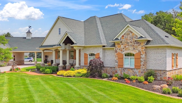 3399 Nottinghill Blvd, Plainfield, IN 46168 - craftsman-style home with stone siding, a front lawn, and a shingled roof