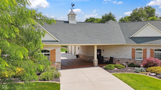 3399 Nottinghill Blvd, Plainfield, IN 46168 - view of front of home featuring driveway, roof with shingles, brick siding, a front lawn, and stone siding