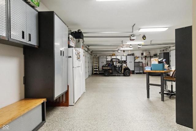 3399 Nottinghill Blvd, Plainfield, IN 46168 - garage with freestanding refrigerator and a garage door opener