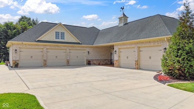 3399 Nottinghill Blvd, Plainfield, IN 46168 - view of front of property with a garage, concrete driveway, brick siding, and roof with shingles