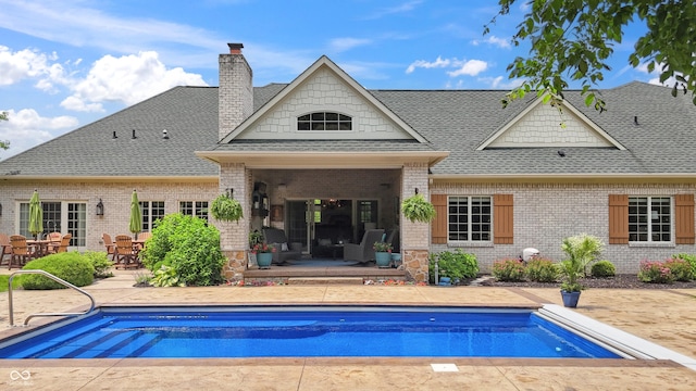 3399 Nottinghill Blvd, Plainfield, IN 46168 - back of house with roof with shingles, a patio area, a chimney, and brick siding