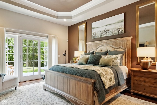 3399 Nottinghill Blvd, Plainfield, IN 46168 - bedroom featuring access to exterior, ornamental molding, wood finished floors, recessed lighting, and a tray ceiling