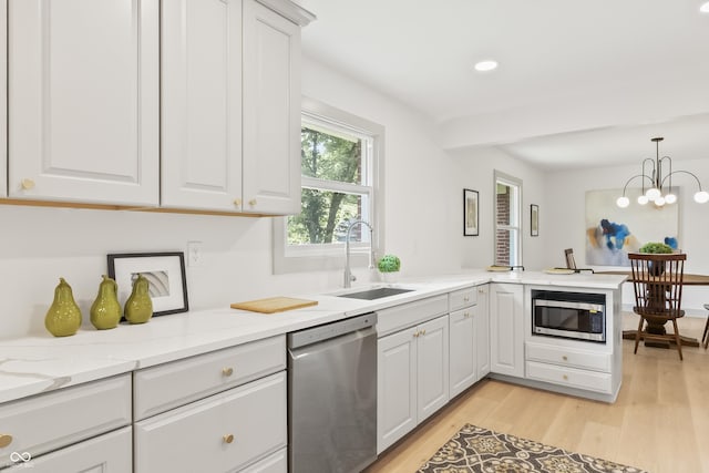 8246 Windcombe Blvd, Indianapolis, IN 46240 - kitchen featuring stainless steel appliances, white cabinets, light wood-style flooring, and recessed lighting