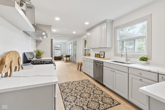8246 Windcombe Blvd, Indianapolis, IN 46240 - kitchen featuring stainless steel dishwasher, gas range oven, healthy amount of natural light, light wood-style floors, and recessed lighting