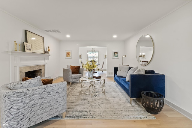 8246 Windcombe Blvd, Indianapolis, IN 46240 - living area with wood finished floors, a premium fireplace, a chandelier, and recessed lighting