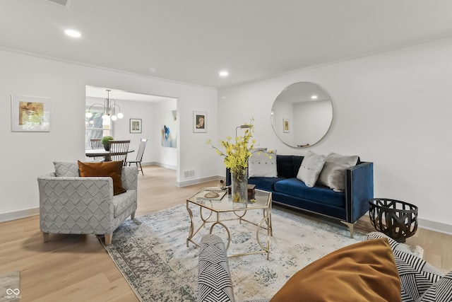 8246 Windcombe Blvd, Indianapolis, IN 46240 - living room featuring light wood-style floors, recessed lighting, a chandelier, and ornamental molding