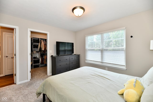3443 Thomas Jefferson St, Westfield, IN 46074 - carpeted bedroom featuring a walk in closet and a closet