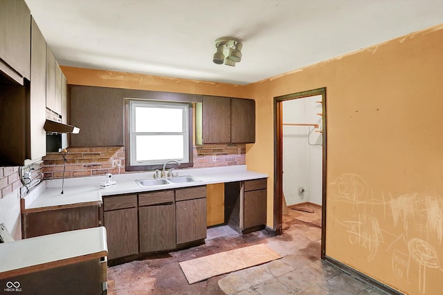 10159 Hodge Rd, Clayton, IN 46118 - kitchen with backsplash, under cabinet range hood, and light countertops