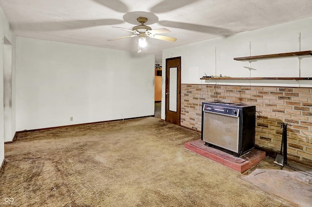 10159 Hodge Rd, Clayton, IN 46118 - unfurnished living room featuring a wood stove, carpet floors, and a ceiling fan
